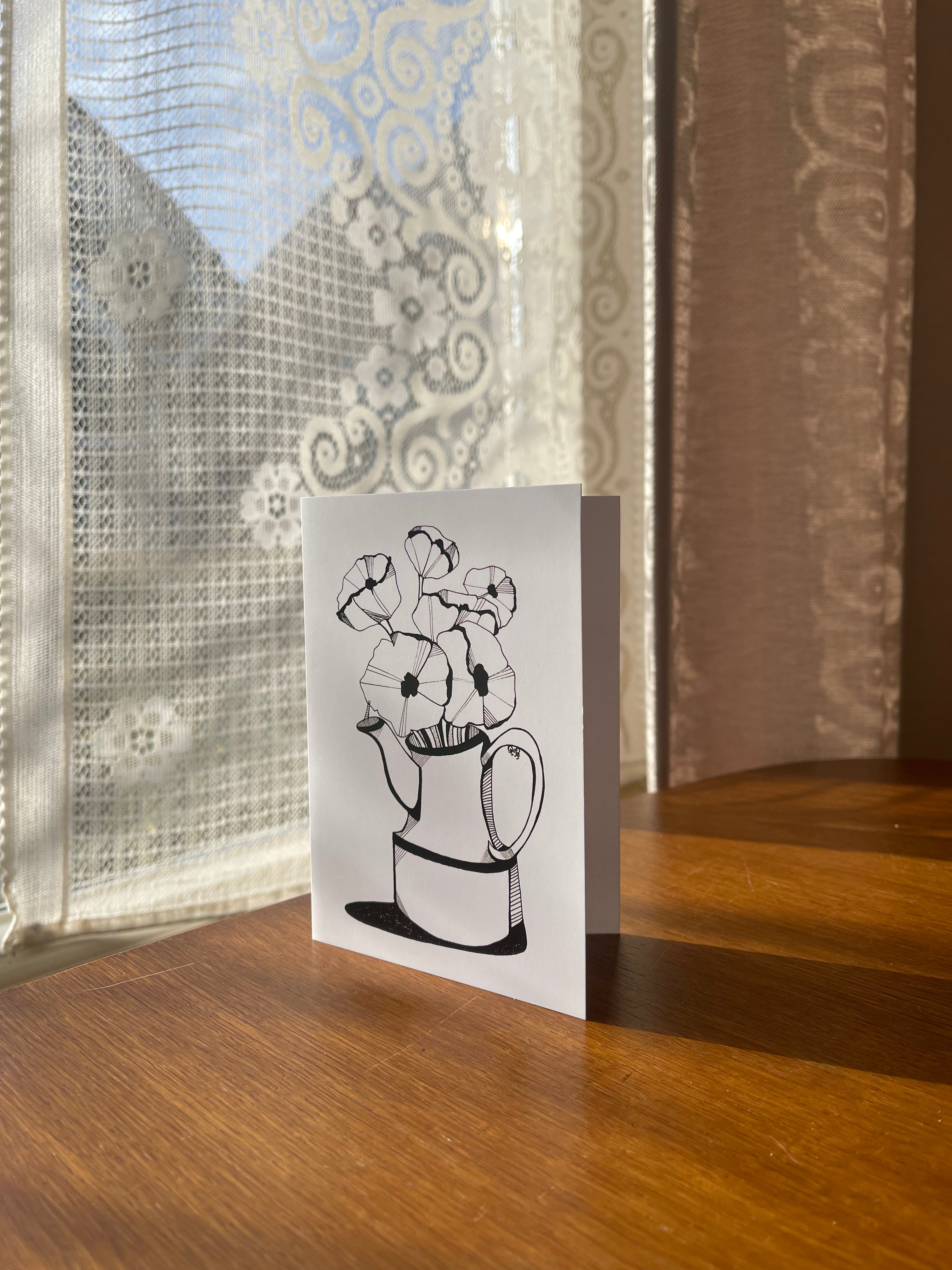 theepot met klaprozen